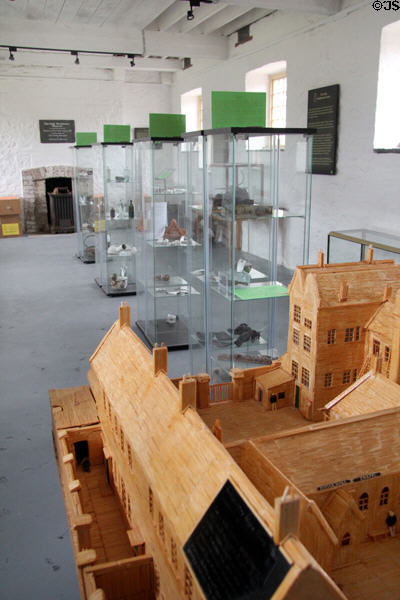 Display of model of Workhouse & items used by residents in museum at Irish Workhouse Centre. Portumna, Ireland.