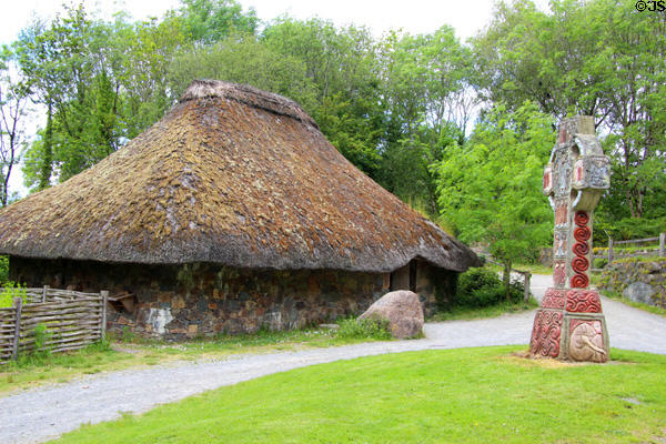 Replica of Irish Monastery building & high cross (900 CE) at Irish National Heritage Park. Ireland.