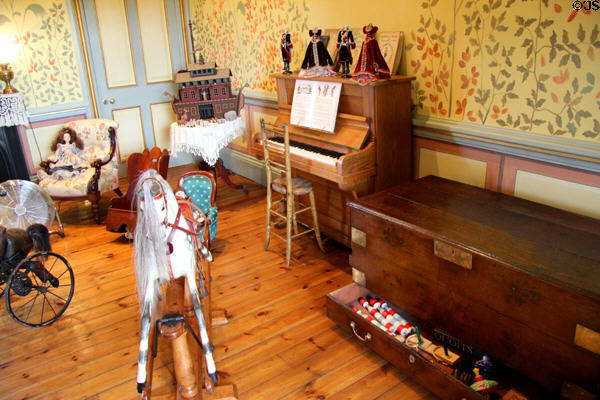 Nursery with piano, chest & display of toys at Kilkenny Castle. Ireland.