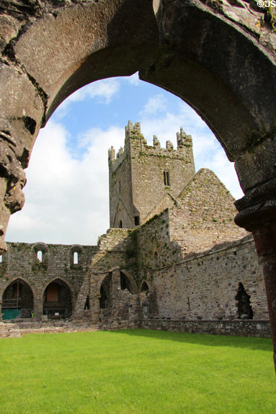 Transept tower seen through arches of cloister at Jerpoint Abbey. Ireland.
