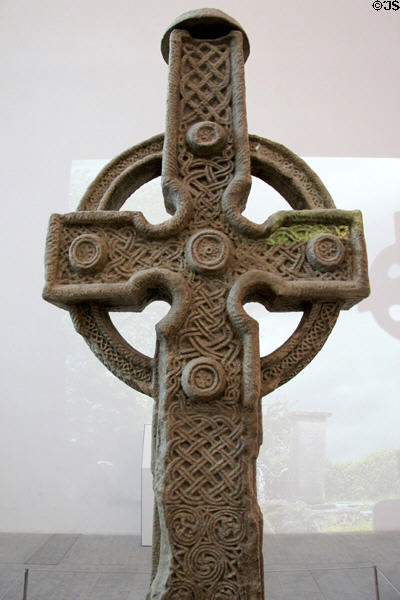 Details of Celtic knots on (800s) plaster replica of south high cross from Ahenny in County Tipperary at Medieval Mile Museum. Kilkenny, Ireland.