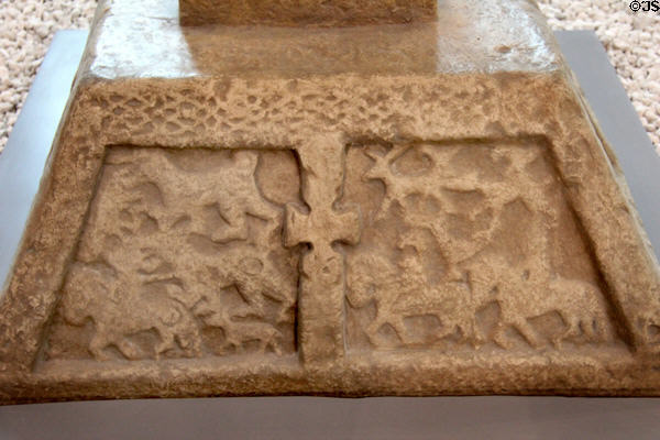 Hunting scene (800s) on plaster replica of south high cross from Ahenny in County Tipperary at Medieval Mile Museum. Kilkenny, Ireland.