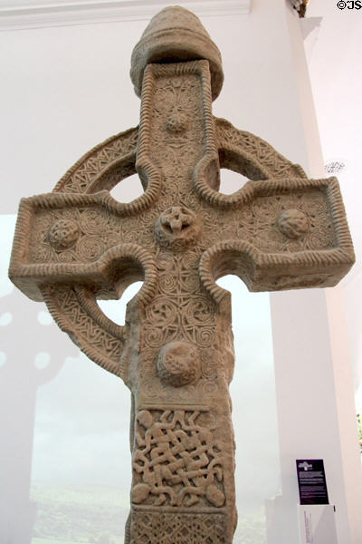 Details of Celtic knots on (800s) plaster replica of north high cross from Ahenny in County Tipperary at Medieval Mile Museum. Kilkenny, Ireland.