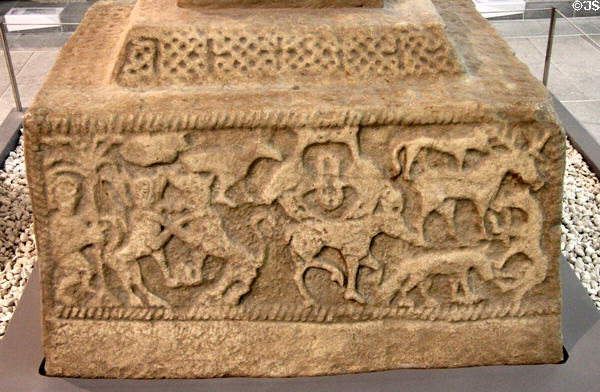 God naming animals creation scene (800s) on plaster replica of north high cross from Ahenny in County Tipperary at Medieval Mile Museum. Kilkenny, Ireland.