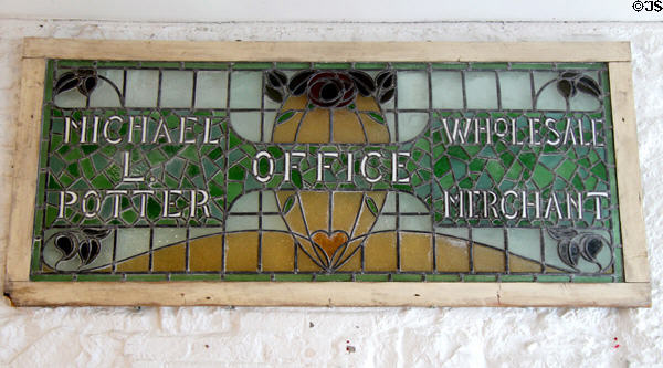 Stained glass sign of merchant who ran business from Rothe House. Kilkenny, Ireland.
