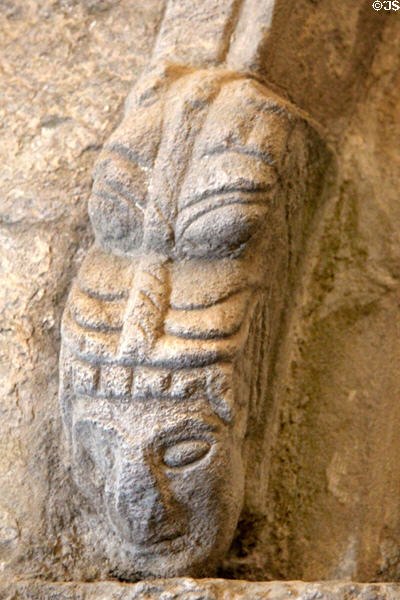 Carved head on arch (12thC) in Cormac's Chapel at Rock of Cashel. Cashel, Ireland.