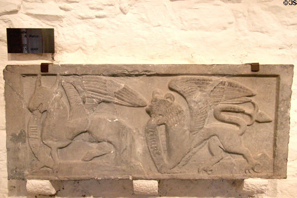 Tomb plaque carved with winged bull & lion symbols of Evangelists St Luke & St Mark at Rock of Cashel. Cashel, Ireland.