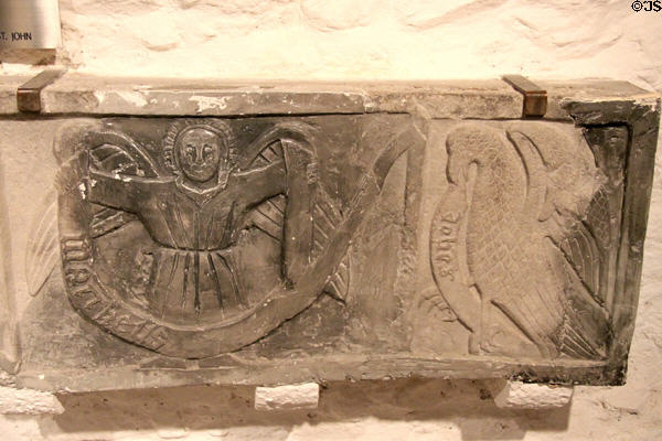 Tomb plaque carved with winged angel & eagle symbols of Evangelists St Matthew & St John at Rock of Cashel. Cashel, Ireland.