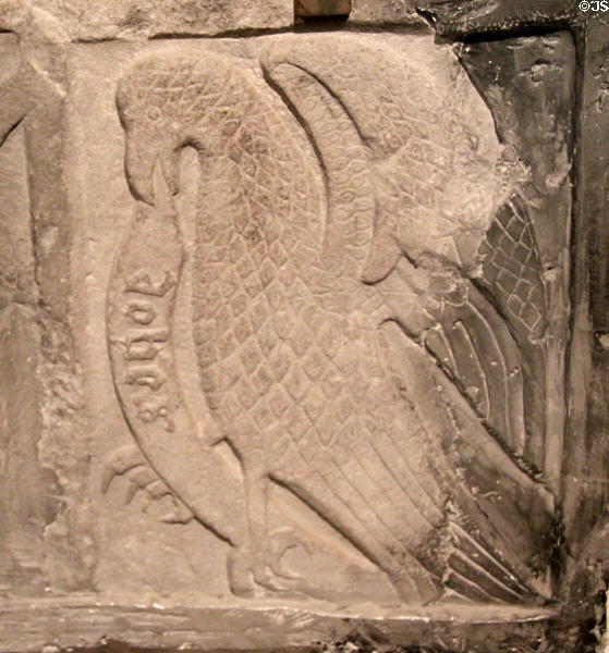 Detail of medieval tomb plaque carved with winged eagle symbol of Evangelist St John at Rock of Cashel. Cashel, Ireland.