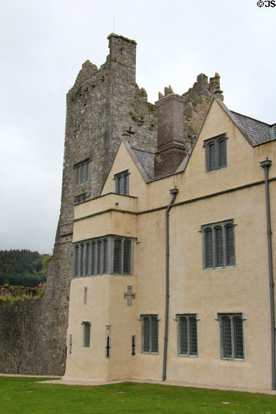 Pink Tudor manor house (16thC) with original (14thC) Ormond Castle beyond. Carrick-on-Suir, Ireland.