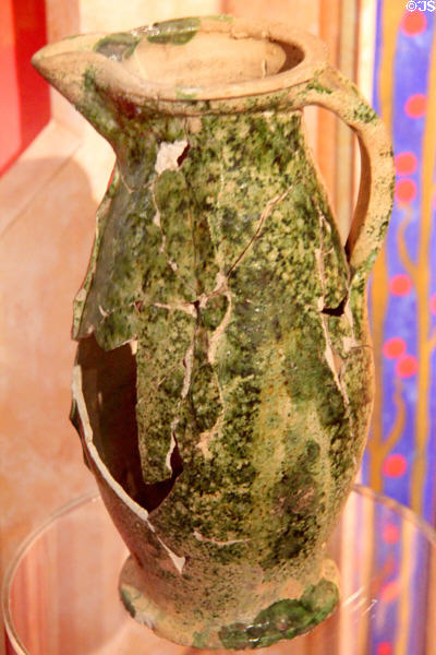 French green-glazed ceramic wine jug (13thC) at Museum of Treasures. Waterford, Ireland.