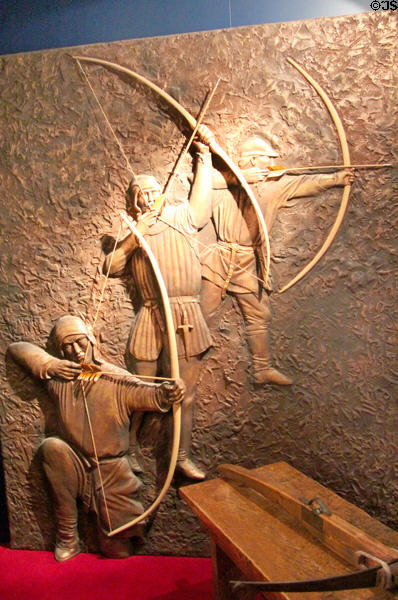 Carving of Medieval archers in gallery at Museum of Treasures. Waterford, Ireland.