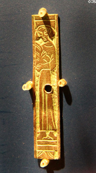 Copper Waterford Lady belt mount (c1250) at Museum of Treasures. Waterford, Ireland.