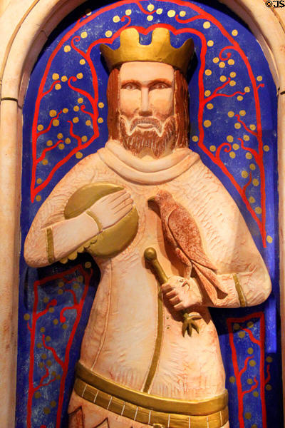 Modern carving of Medieval king with falcon in gallery displaying Museum of Treasures' Great Charter Roll. Waterford, Ireland.