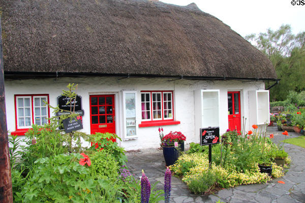 Thatched roof & red trimmed cottage. Adare, Ireland.