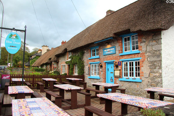 The Blue Door Restaurant with thatched roof & blue trim. Adare, Ireland.