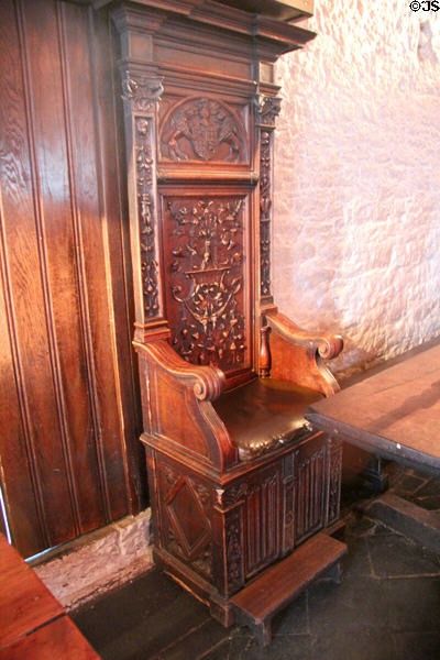 Ceremonial carved wooden chair in Main Guard at Bunratty Castle. County Clare, Ireland.