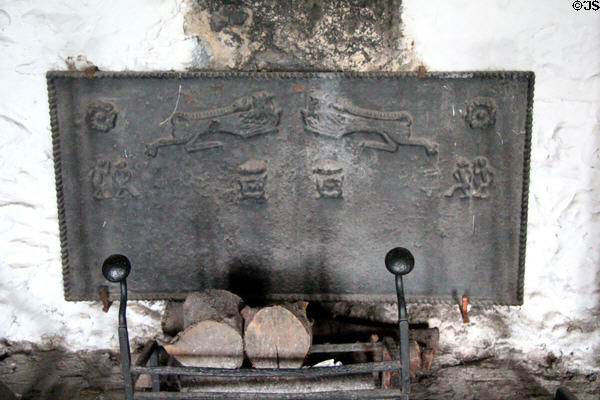 Cast iron fireplace back in Earl's private apartments at Bunratty Castle. County Clare, Ireland.