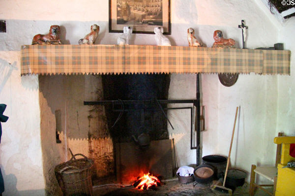 Fireplace mantel with ceramic King Charles Spaniel figurines in Loop Head House at Bunratty Castle & Folk Park. County Clare, Ireland.