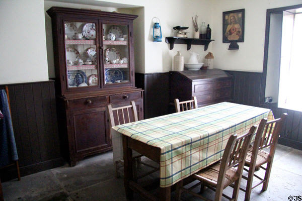 Dining table & dish cupboard of Doctor's house at Bunratty Castle & Folk Park. County Clare, Ireland.