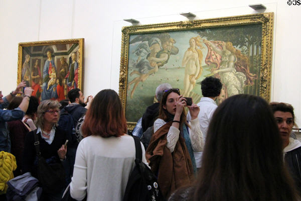 Crowds before Botticelli paintings at Uffizi Gallery. Florence, Italy.
