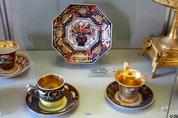 Porcelain cups & plate (early 1800s) by Doccia manufactory of Florence at Pitti Palace Ceramics Museum. Florence, Italy.