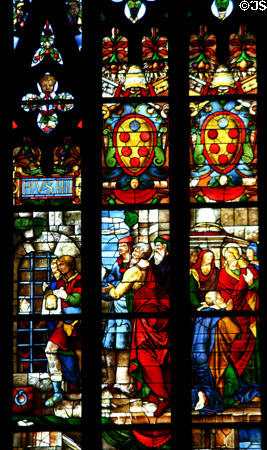 Carrying image of Christ in stained-glass of Duomo. Milan, Italy.