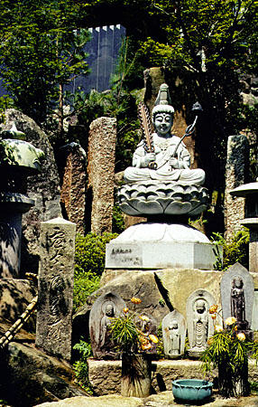 Offerings and stone statues at the Daishoin temple in Miya-jima. Japan.