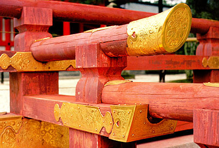 Golden metal decorations on the wooden beams of the Heian-jingu Shrine. Japan.