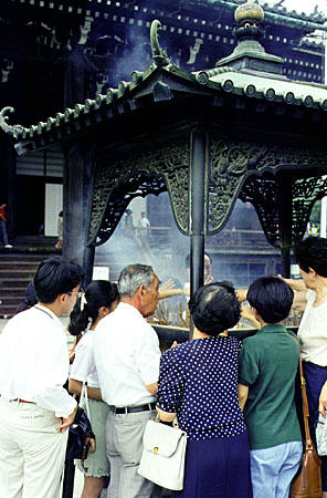 Burning incense at the Chion-in Temple, Kyoto. Japan.