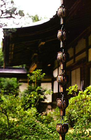 Ornate drain chain hanging from a house in Takayama. Japan.