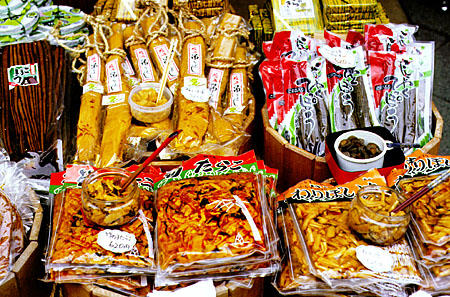 Free samples are offered of Japanese foods. Japan.