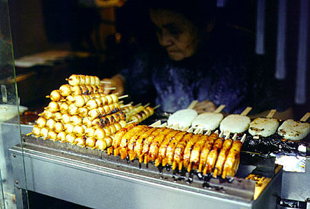 Grilling at a street stand in Nara. Japan.