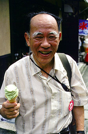 Man with a Green Tea ice cream cone in Kyoto. Japan.