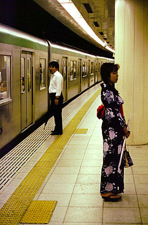Kyoto subway and woman in Yukata. Japan.