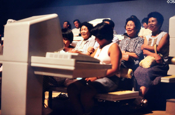Audience participates with computer terminals during show at Expo 85. Tsukuba, Japan.