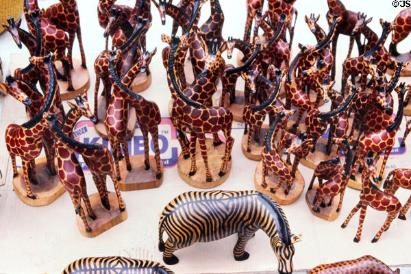 Carved wooden zebras & giraffes at a crafts market on northeastern fringe of Nairobi. Kenya.