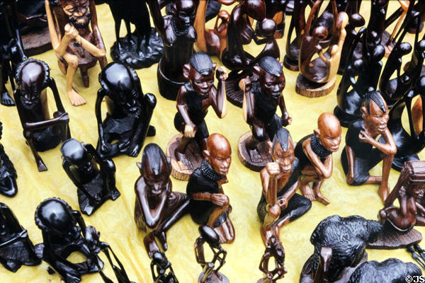 Carved seated ebony Africans at a crafts market in Nairobi suburbs. Kenya.