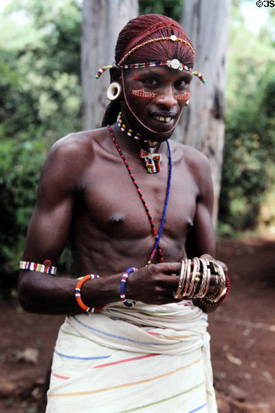 An African models his traditional dress in Bomas near Nairobi. Kenya.