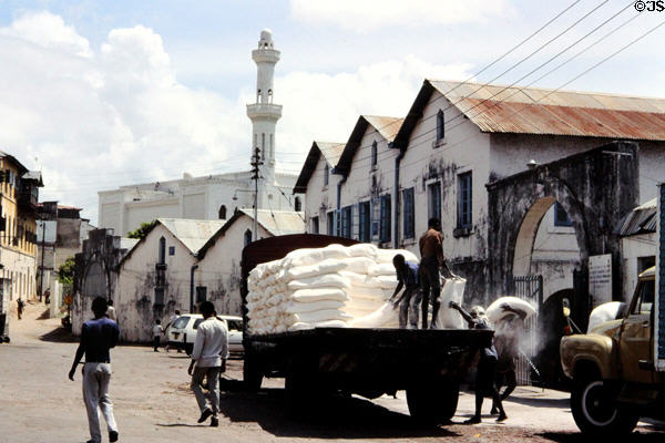 Unloading a truck amongst buildings in old town Mombasa. Kenya.