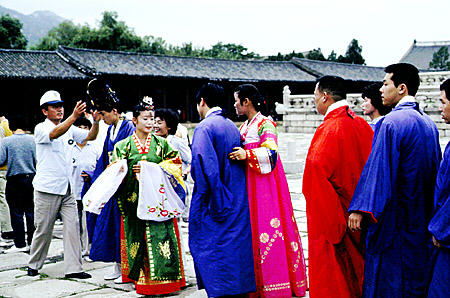 Japanese tourists dress in formal Korean wear at Kyongbok Palace, Seoul. South Korea.