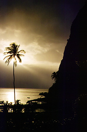 Setting sun above the beach at the Jalousie Hilton Resort near Soufrière. St Lucia.