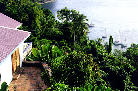 Guest chalet overlooks yachts anchored below the Stonefield Estate near Soufrière. St Lucia.