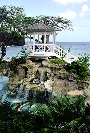 A gazebo and cascades on the grounds of Sandals La Toc resort near Castries. St Lucia.