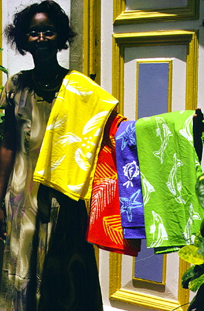Some of the colorful Batiks demonstrated by a manager at Caribelle Batik on Morne Fortune. St Lucia.