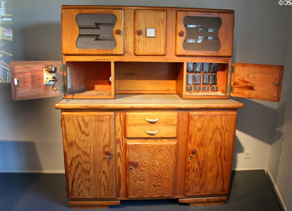 Pinewood kitchen cabinet with built-in bread box, coffee grinder & glass containers (1934) from Capesius-Reding d'Hesperange at National Museum of History & Art. Luxembourg, Luxembourg.