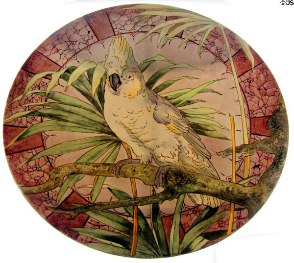 Fine earthenware with polychrome decoration round platter depicting a cockatoo on a branch (c1900) made by Villeroy & Boch at Septfontaines-lez-Luxembourg at National Museum of History & Art. Luxembourg, Luxembourg.