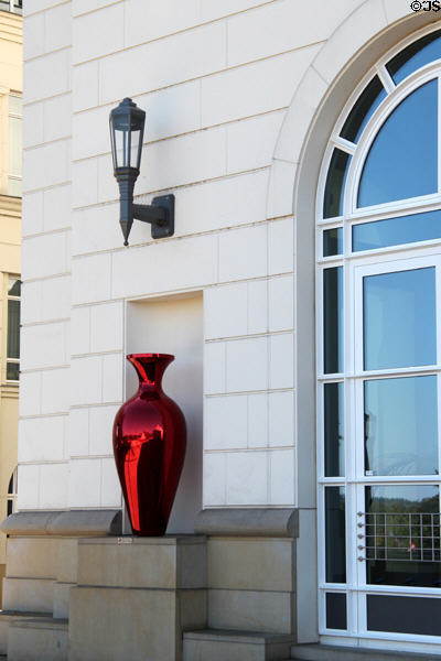 Decorative red vase contrasting white stone of Court building. Luxembourg, Luxembourg.