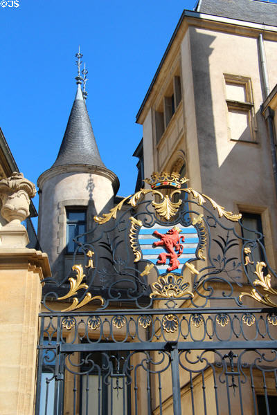 Ornate gilded ironwork with civil ensign on gate to Grand Ducal Palace. Luxembourg, Luxembourg.