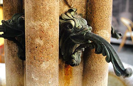 Detail of fountain next to Cathedral on Place St Nicholas in Monaco.